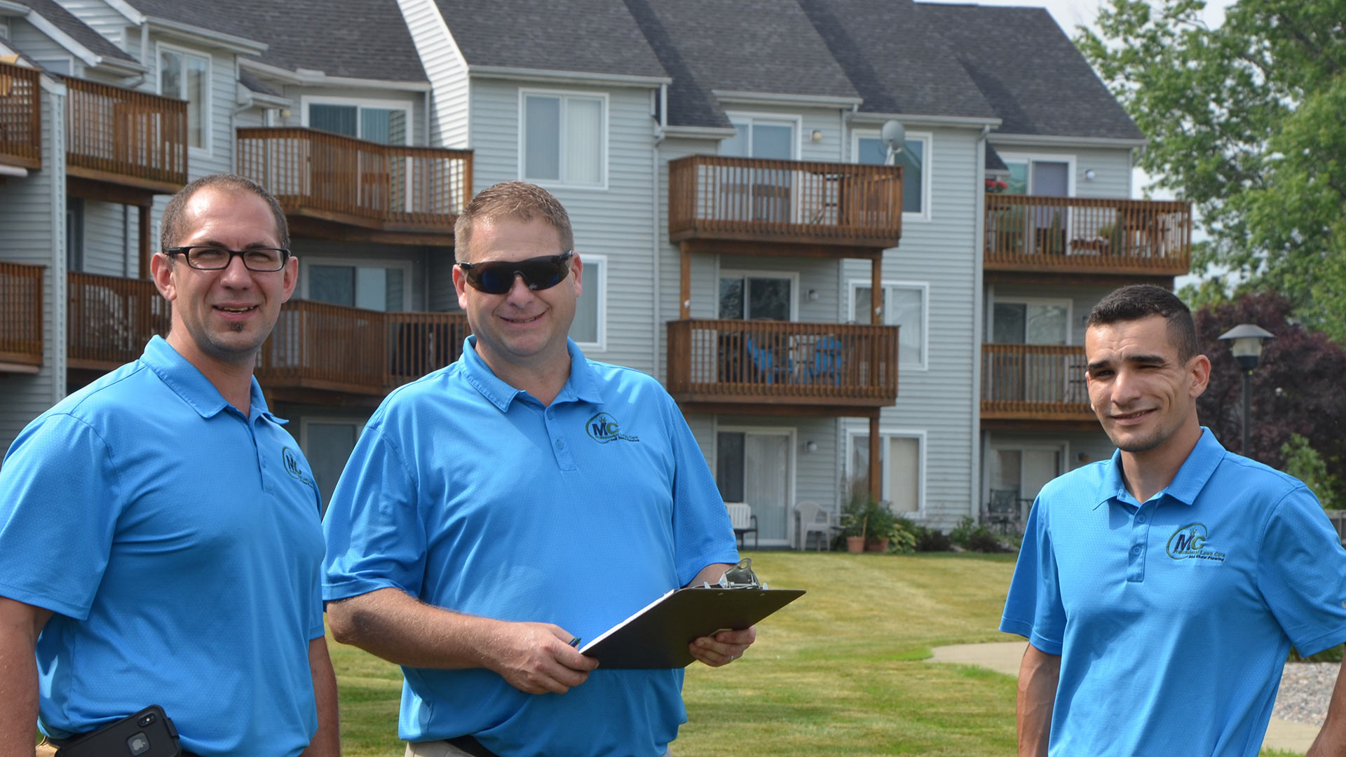 MC Professional Lawn Care and Snow Plowing leadership team at a commercial property in Madison, OH.